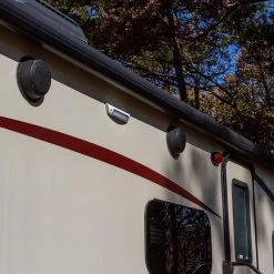 9" LED RV/Camper Porch Utility Light - 1450 Lumens, 18W, 3000K Warm White, Black Awning Flood Light -Nebo Sales Store val2 nw9 wh installed on rv